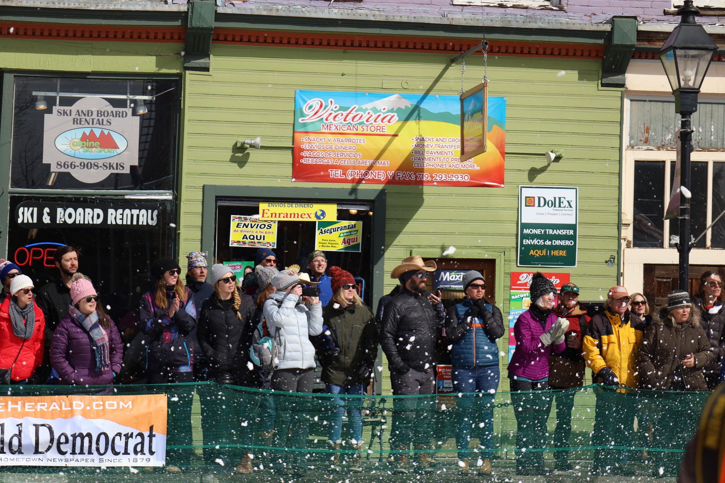 a cheering crowd watches from the sidelines