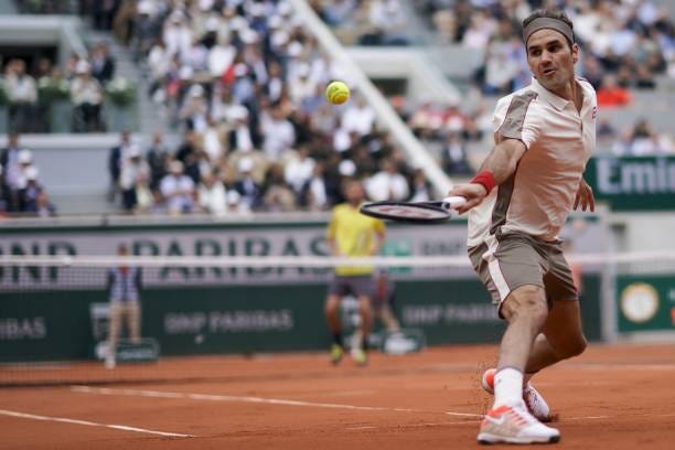 Switzerland's Roger Federer plays a forehand return to Germany's Oscar Otte during their men's singles second round match on day four of The Roland... Switzerland's Roger Federer plays a forehand return to Germany's Oscar Otte during their men's singles second round match on day four of The Roland...