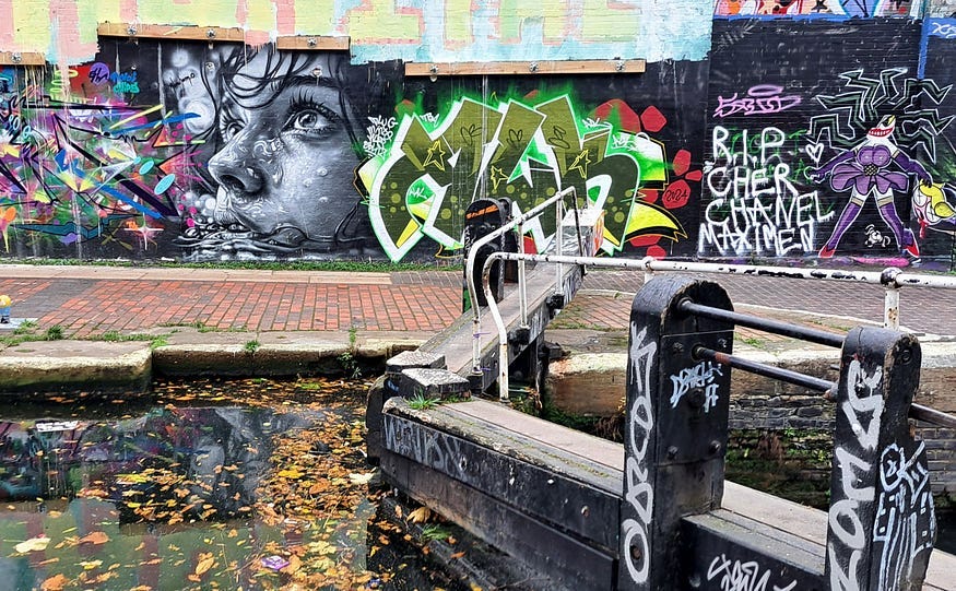 Street art looking across the lock gates at Old Ford east London