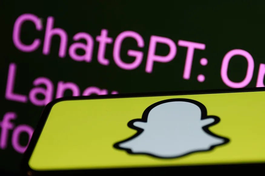 OpenAI ChatGPT website displayed on a laptop screen and Snapchat logo displayed on a phone screen are seen in this illustration photo taken in Krakow, Poland on February 27, 2023. (Photo by Jakub Porzycki/NurPhoto via Getty Images)