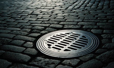 Close up of a manhole cover on the street. Close up of a manhole cover on the street.