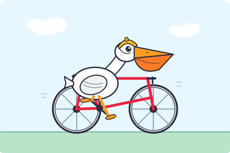 Cartoon illustration of a white pelican with an orange beak riding a red bicycle against a pale blue sky with clouds and a green strip of grass below. The pelican wears a small yellow helmet that looks a bit like it belongs to a Roman centurion, has rosy cheeks, and its orange webbed feet rest on the yellow pedals.