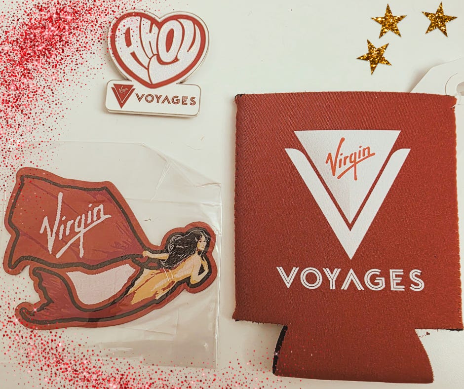 Image of Brilliant Lady mermaid felt sticker, a magnet that says, "ahoy sailors", and a drink cover with the virgin voyages logo on it