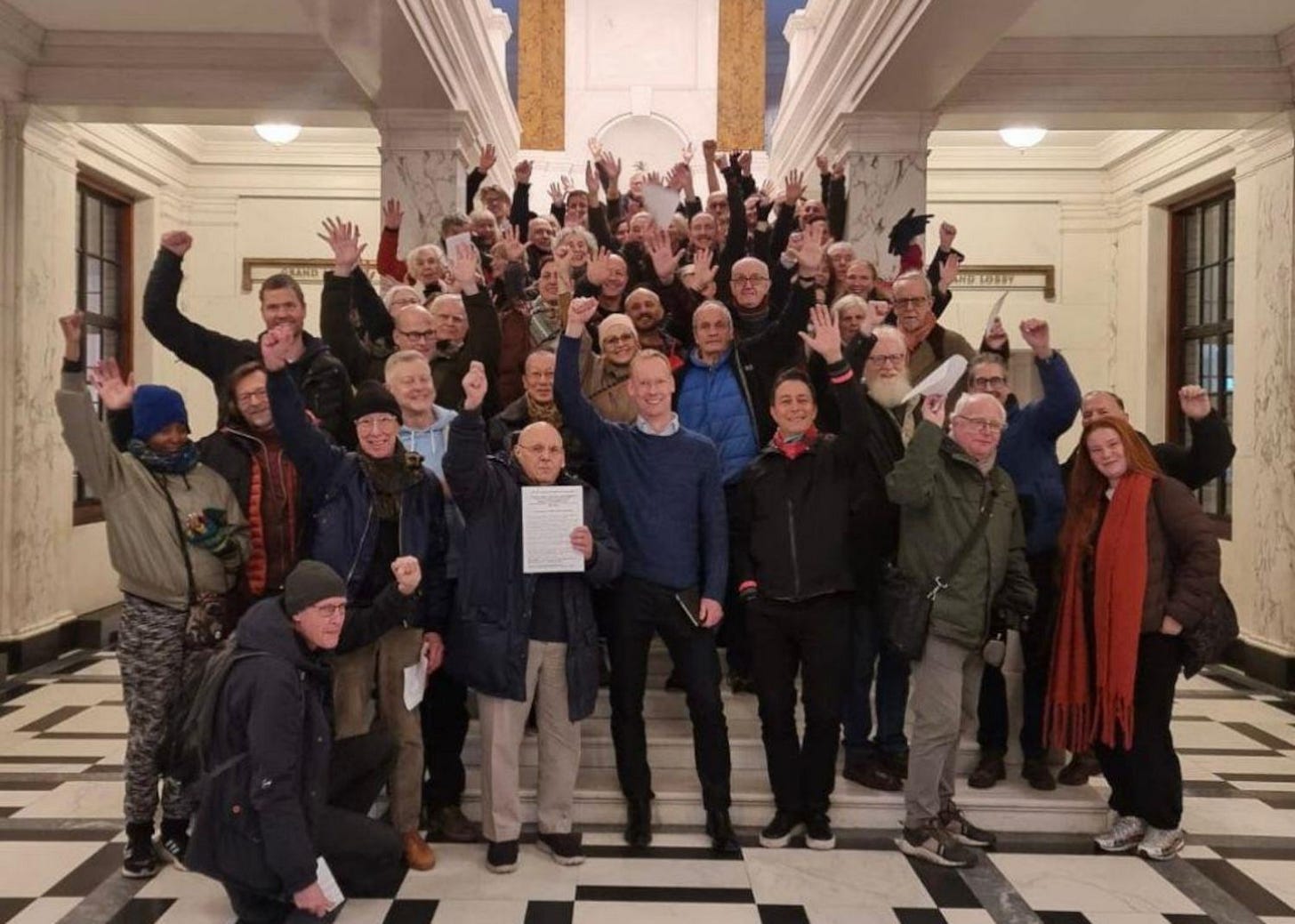 Campaigners standing on staircase at Camden Town Hall.