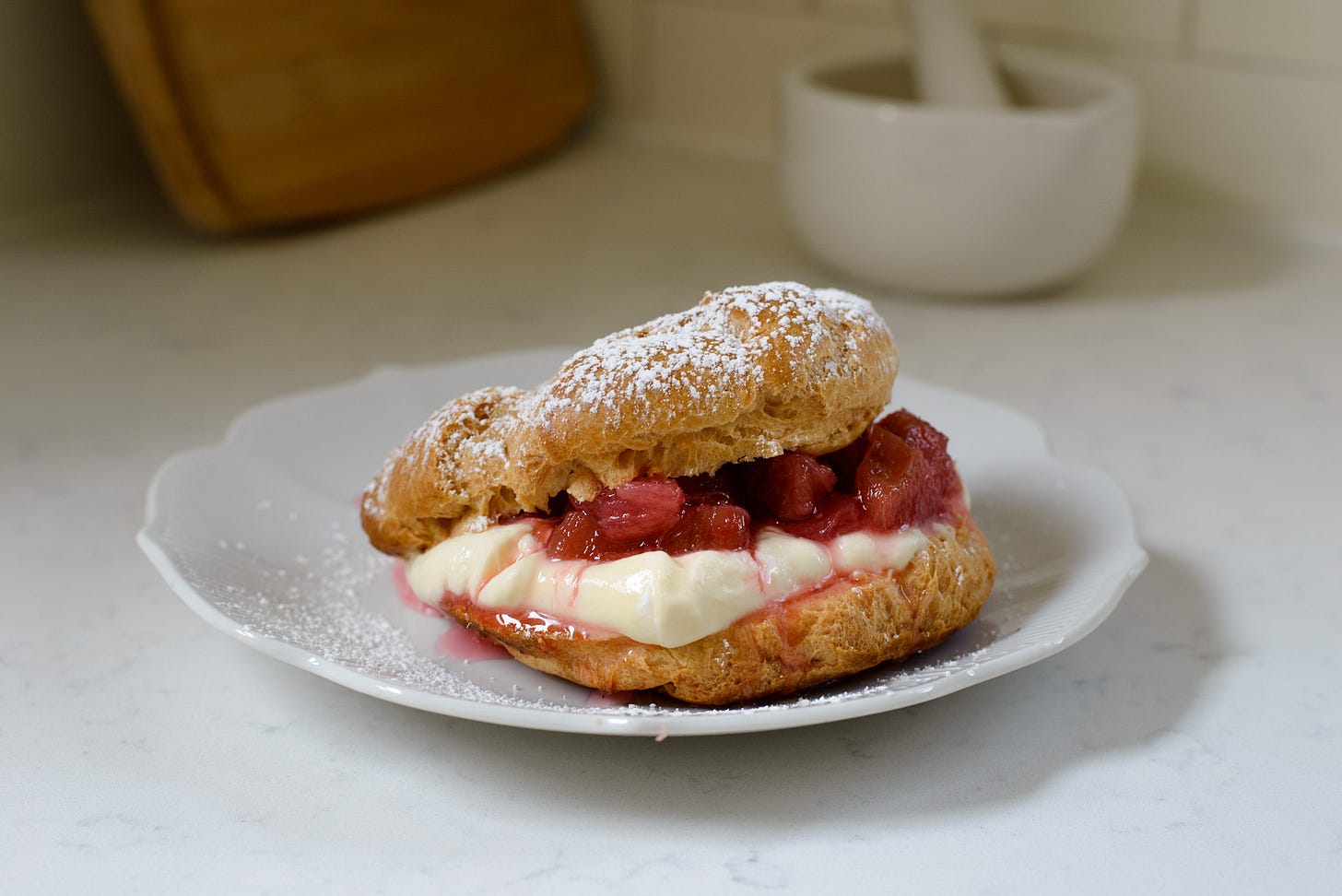 Magnolia Rhubarb Cream Puff on a plate
