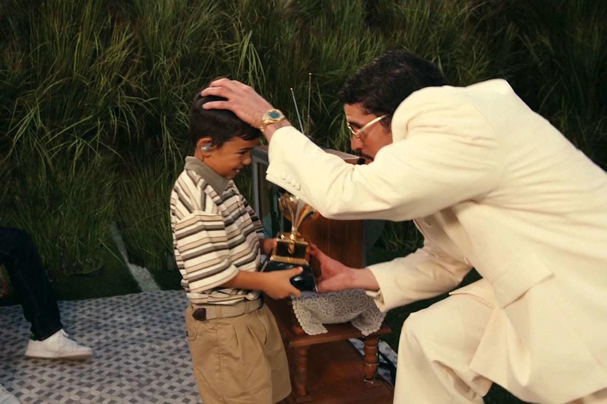 Bad Bunny handing his Grammy to a little boy at the Super Bowl in February 2026 &nbsp;NBC