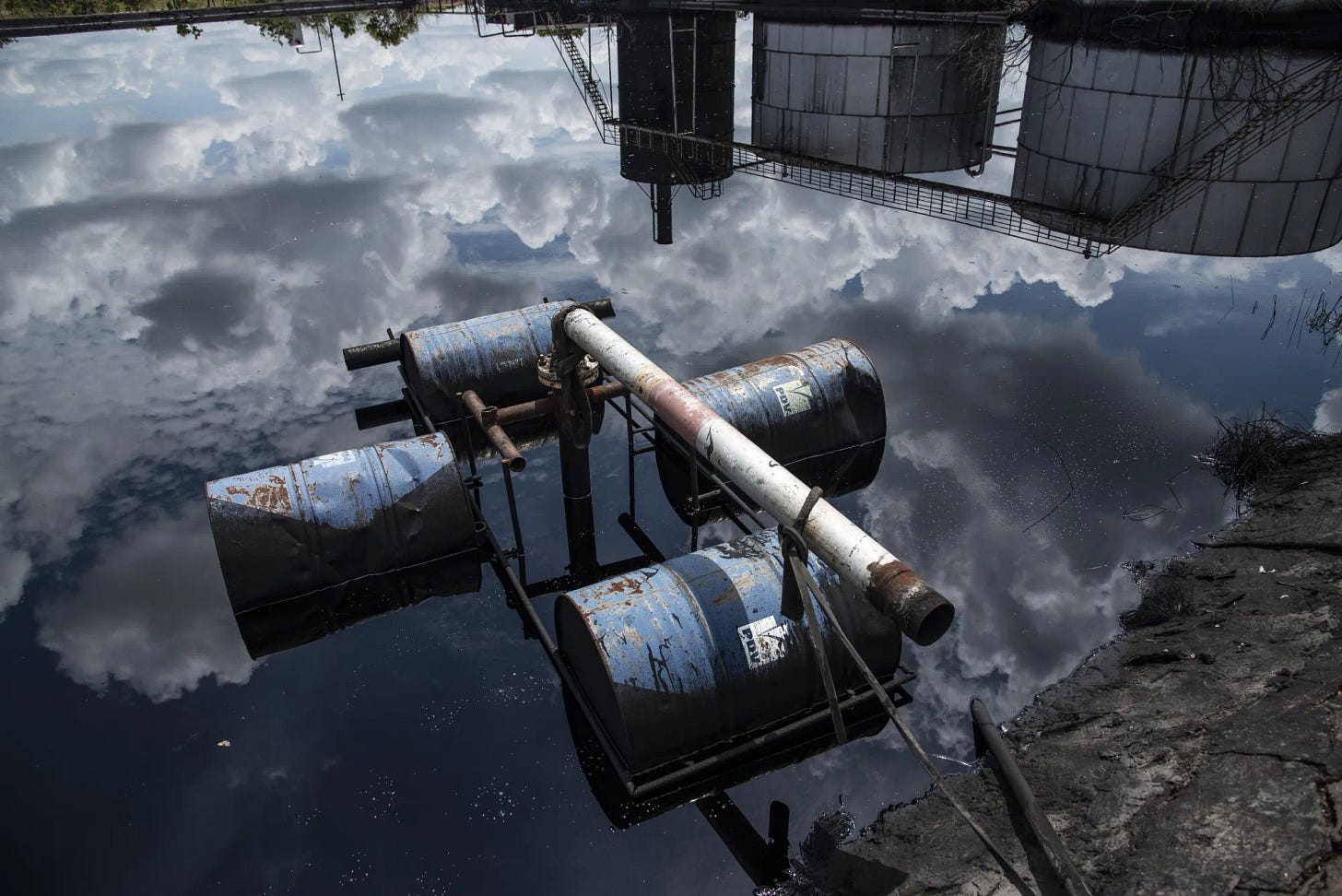 Rusty tanks float on an oil spill in the Orinoco Belt, near El Tigre in Anzoategui state on Oct. 12, 2018.