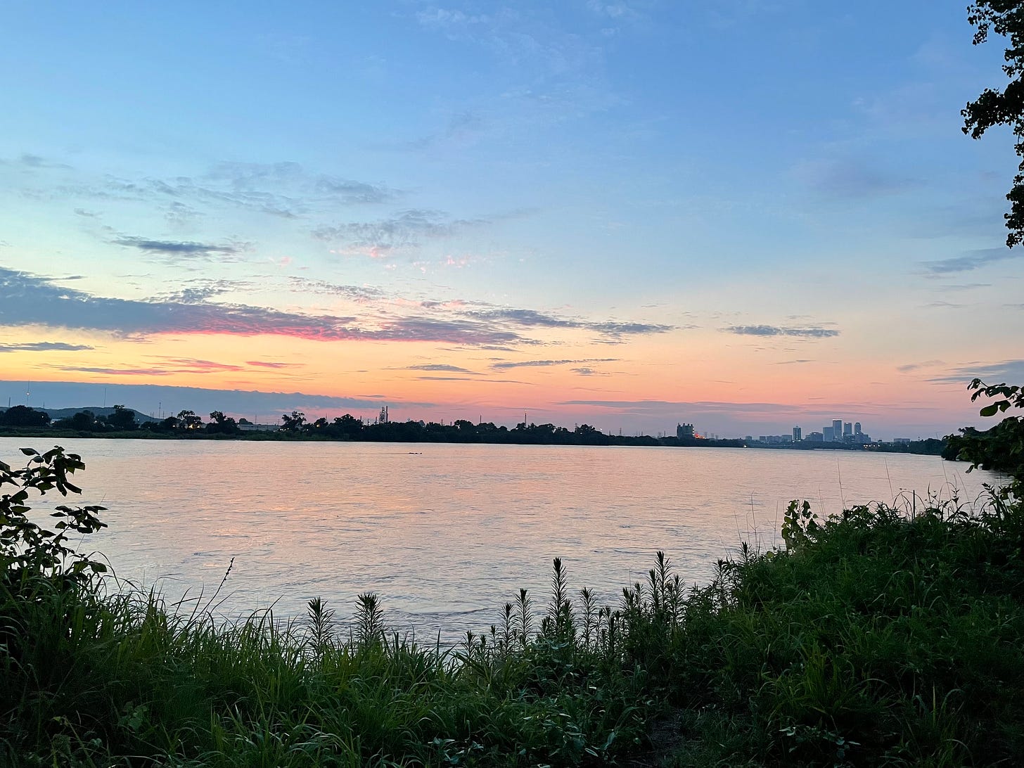 Tulsa skyline over the river at dusk