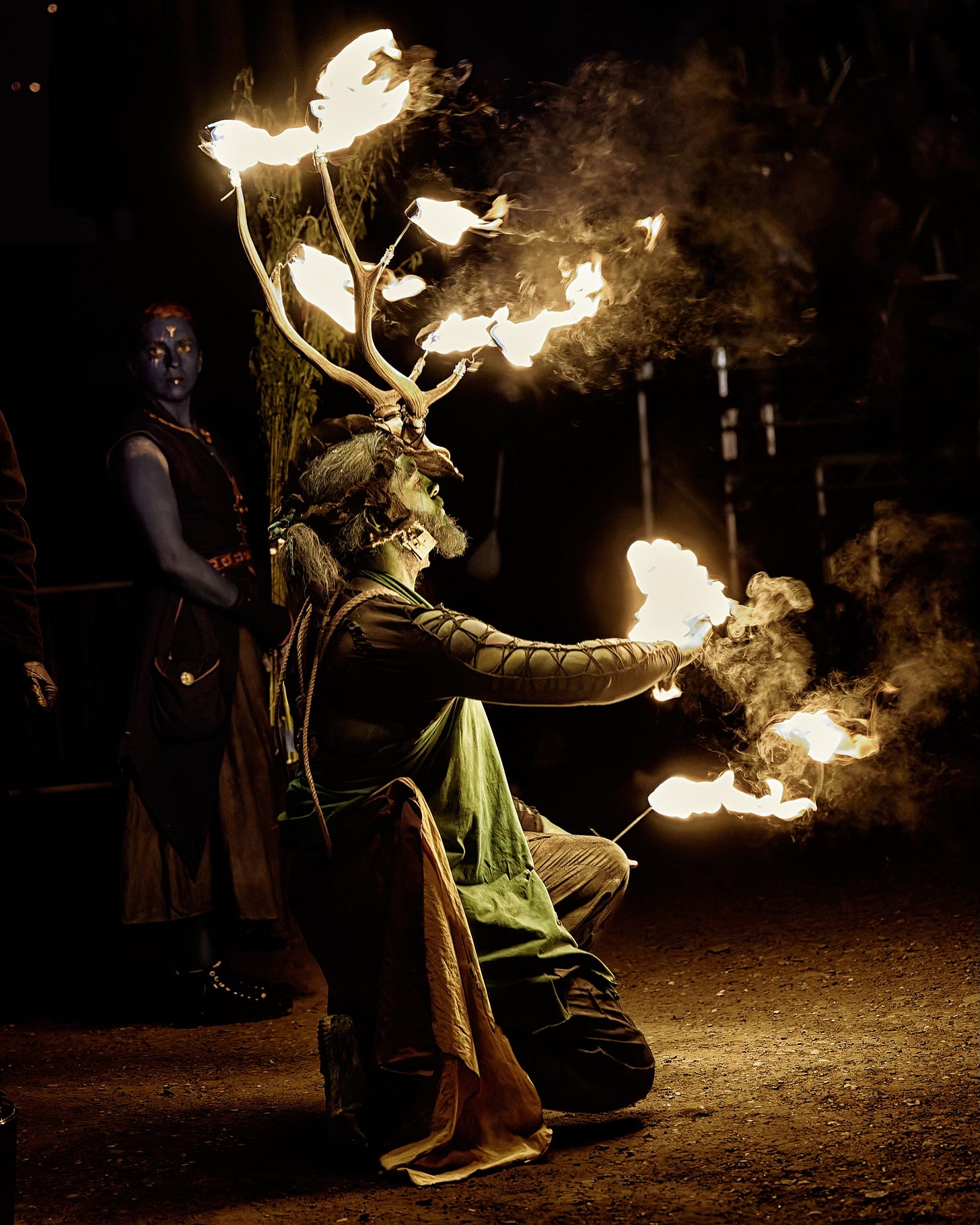 This documentary fieldwork photograph shows the Winter Green Man in flames. He must burn for the Summer Green Man to be reborn. Beltane, Edinburgh 2026