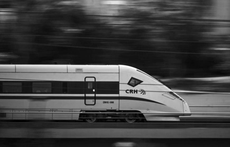 white and blue train on track during night time white and blue train on track during night time