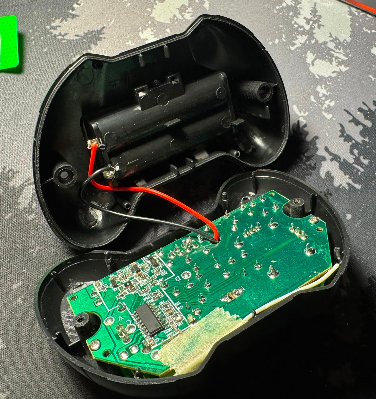 Controller internals, showing back of main board and battery power leads to board