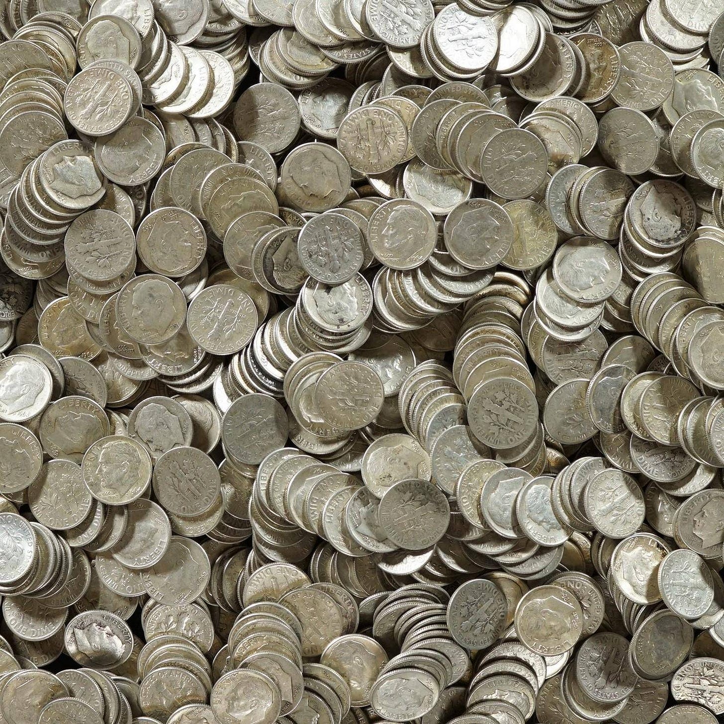 A very large pile of dime coins, seen from above A very large pile of dime coins, seen from above