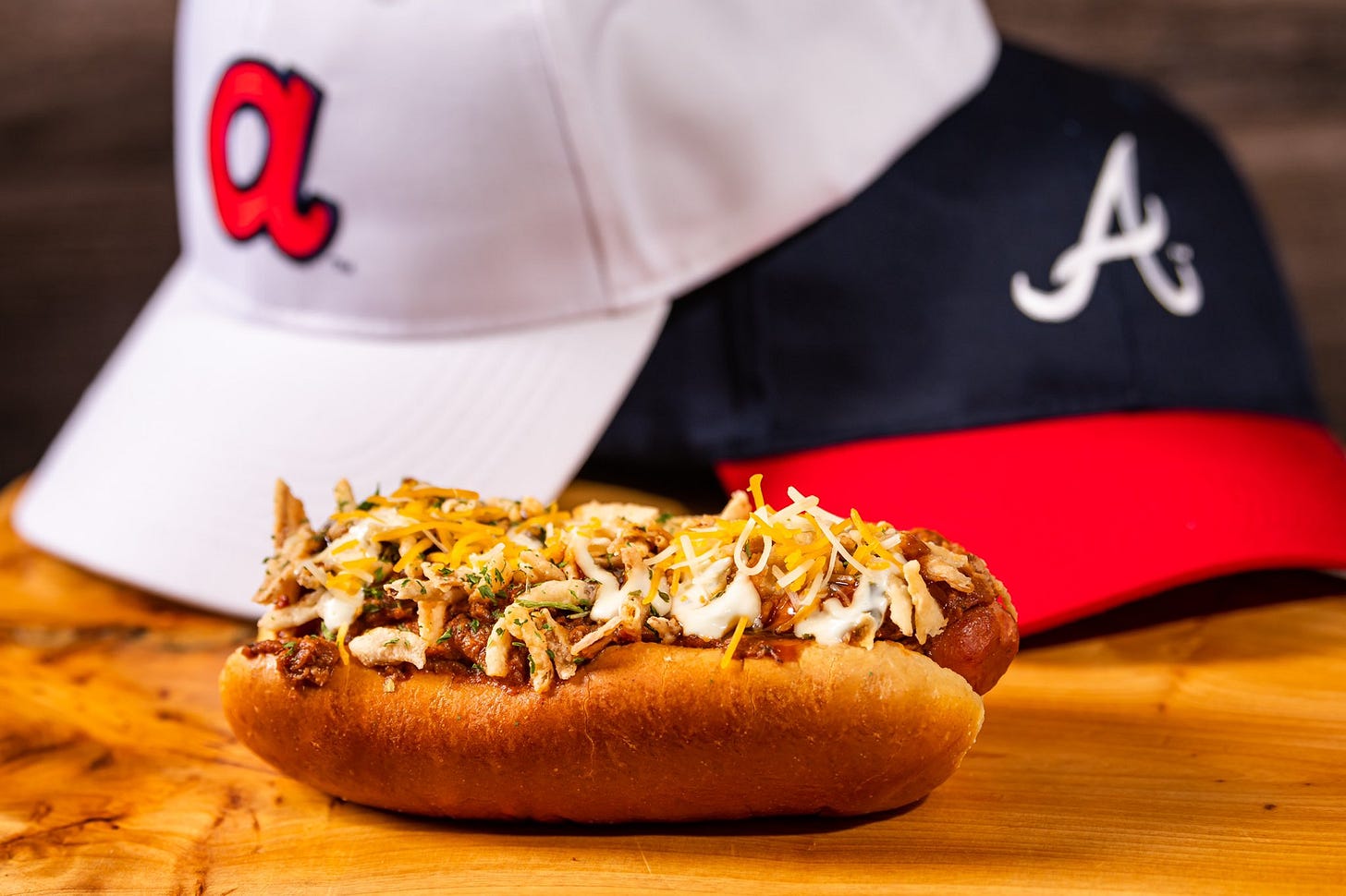 THE ‘DOUILLE DOG:

Andouille Sausage topped with beef chili, onion and cheddar cheese.