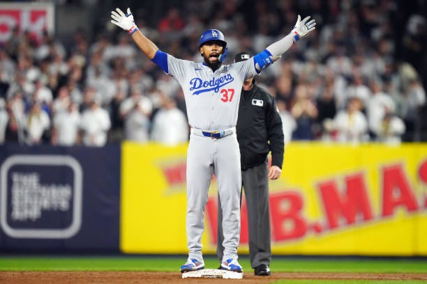 Teoscar Hernández of the Los Angeles Dodgers reacts after hitting a two-run double in the fifth inning during Game 5 of the 2024 World Series...