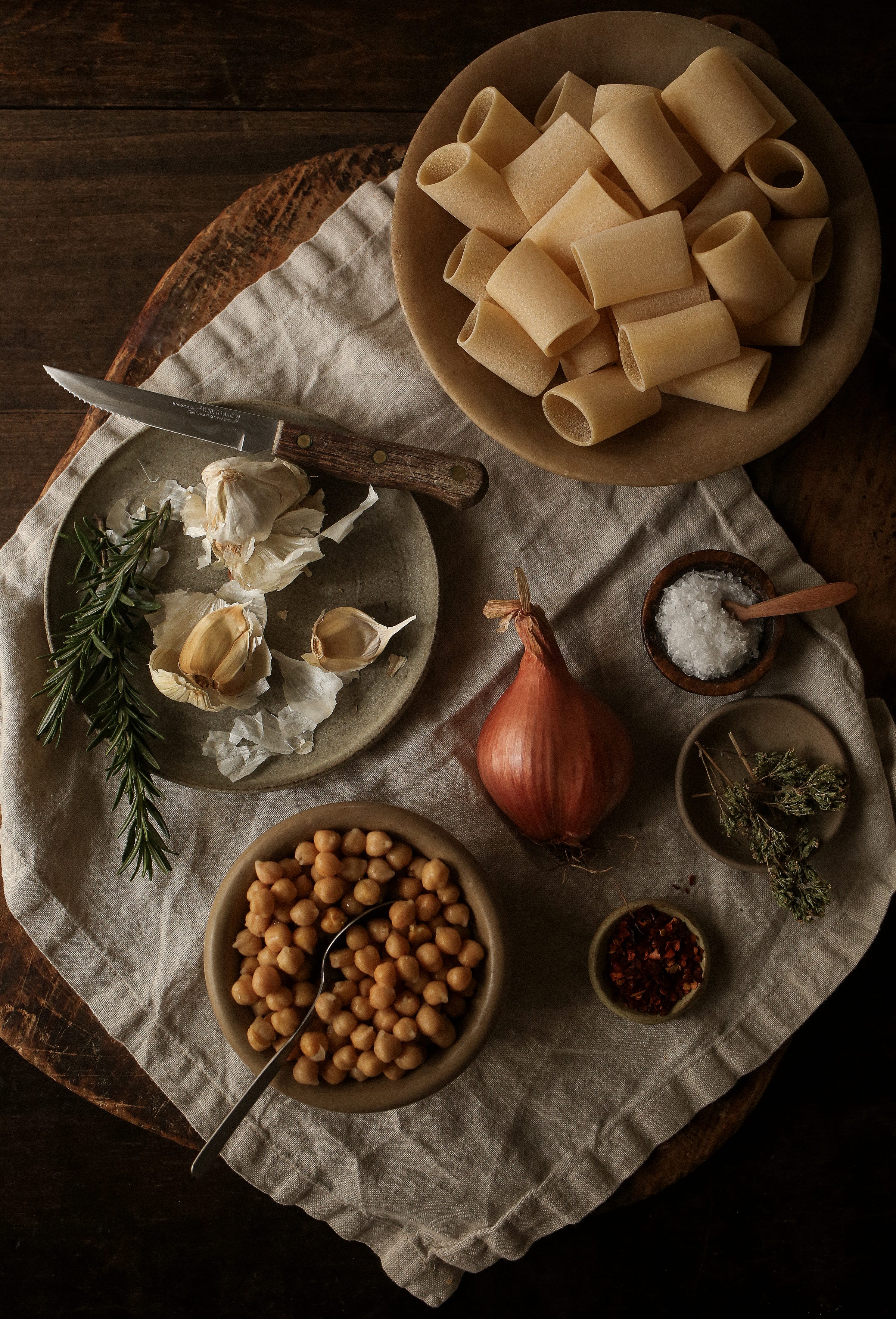 Ingredients for pasta e ceci: chickpeas, olive oil, garlic, shallot, rosemary, and pasta