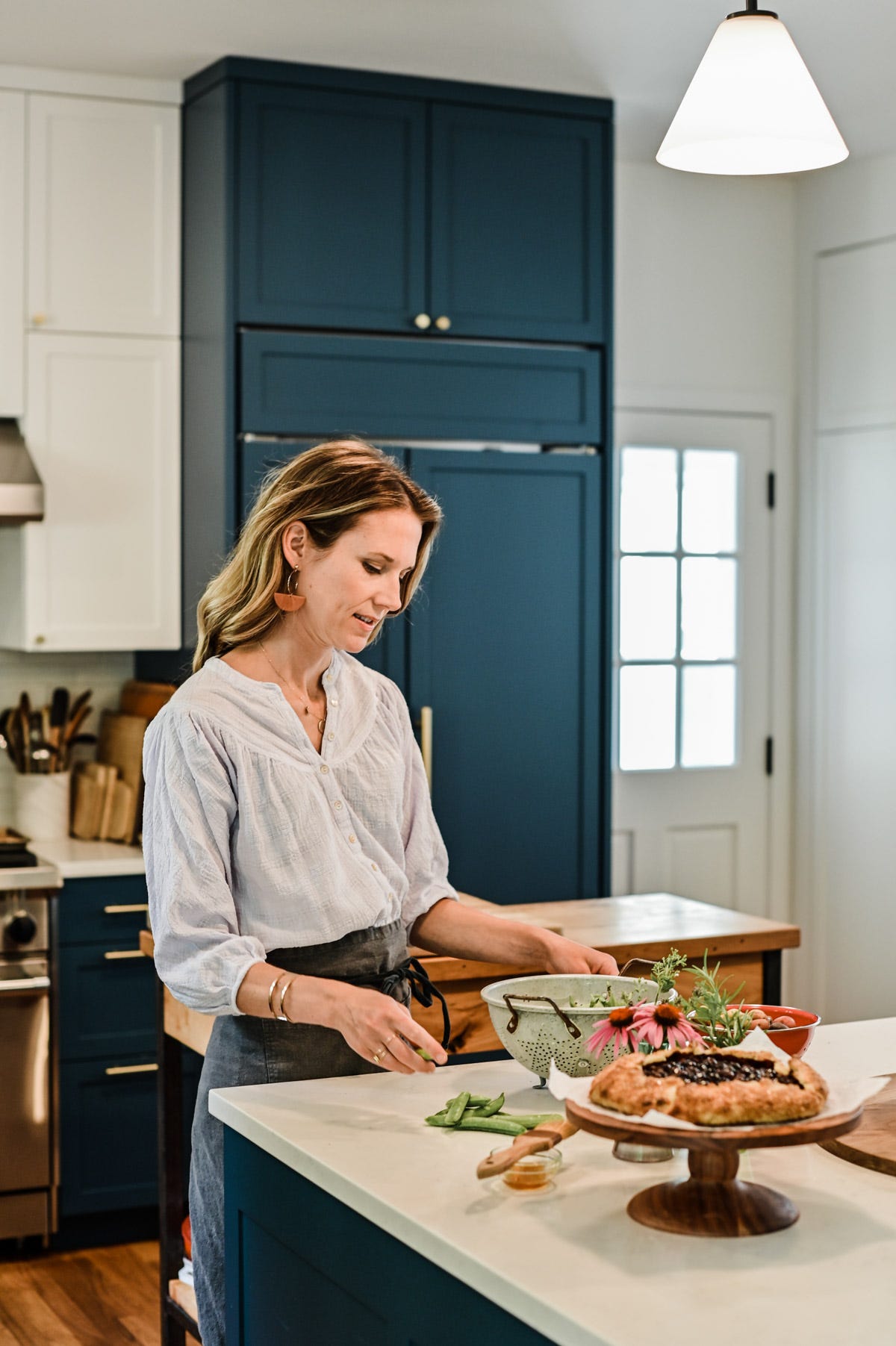 Nicki in the kitchen by the countertop. Nicki in the kitchen by the countertop.