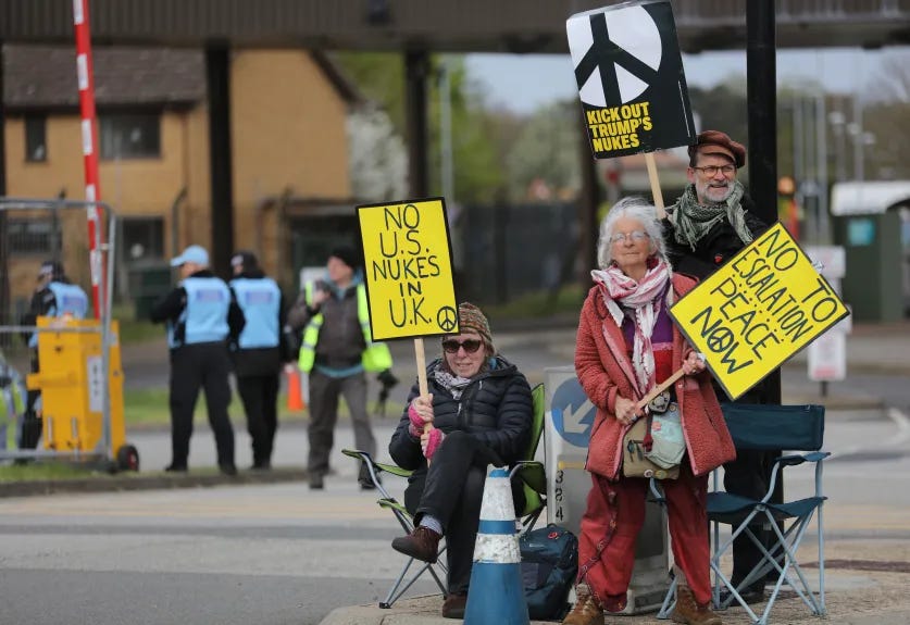 protester with sign No US Nukes in UK