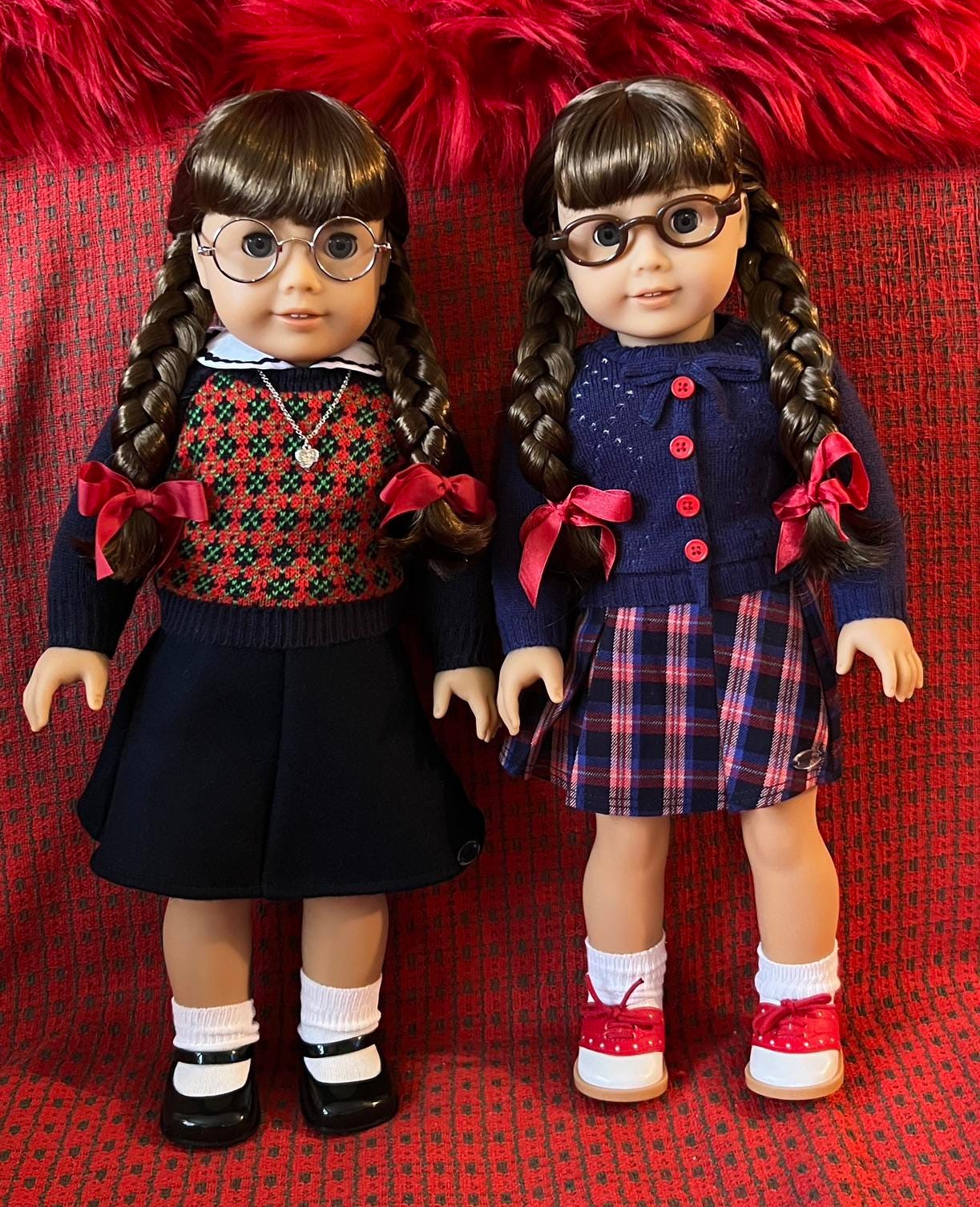 Why do my 2 Molly dolls look so different from each other ?? My first Molly  was the plaid skirt one, and I really like her. I thought the Molly with  argyle