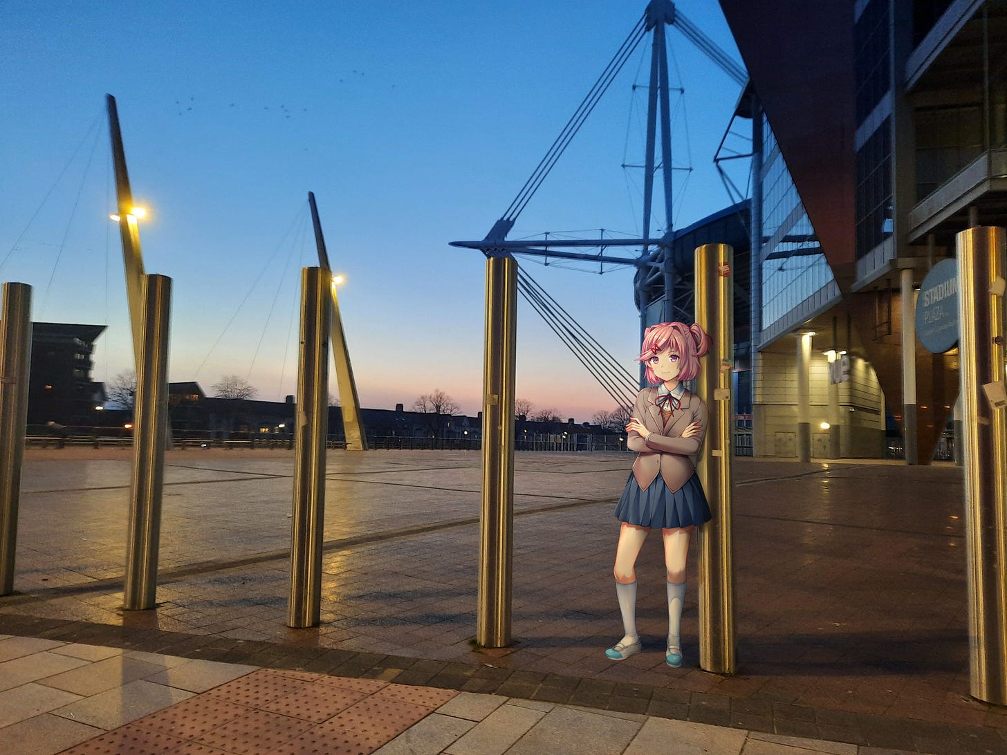 A drawn image of Natsuki from Doki Doki Literatue Club, edited into a real picture of a walkway in front of a stadium.