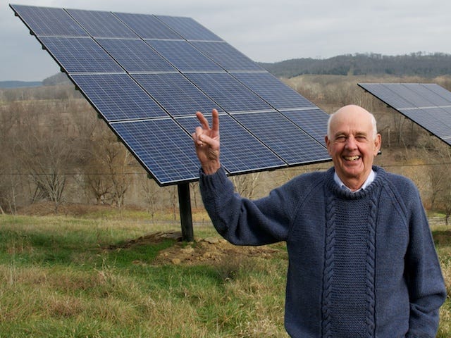 Wendell Berry smiling and flashing a peace sign in front of solar panels on his Henry County, Kentucky, farm Wendell Berry smiling and flashing a peace sign in front of solar panels on his Henry County, Kentucky, farm