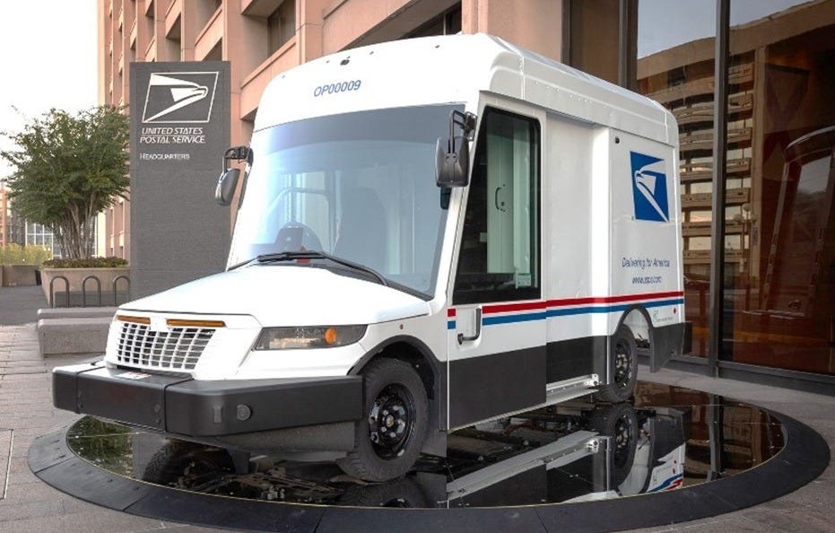 The Postal Service's new delivery truck, which has a goofy bulbous profile due to its cartoonishly large front windshield, is displayed outside the entrance to USPS headquarters in Washington DC The Postal Service's new delivery truck, which has a goofy bulbous profile due to its cartoonishly large front windshield, is displayed outside the entrance to USPS headquarters in Washington DC