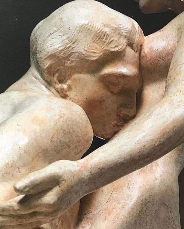 This may contain: an image of a statue that looks like it is hugging someone