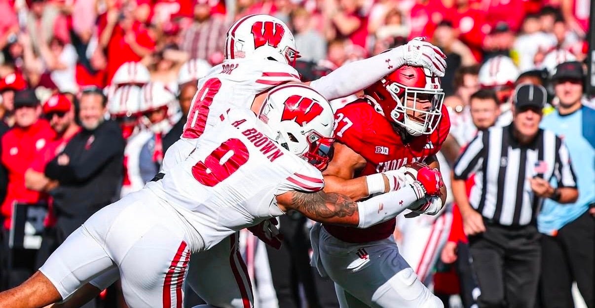 Wisconsin’s Mason Posa and Austin Brown attempt to tackle Indiana tight end Riley Nowakowski at Memorial Stadium.