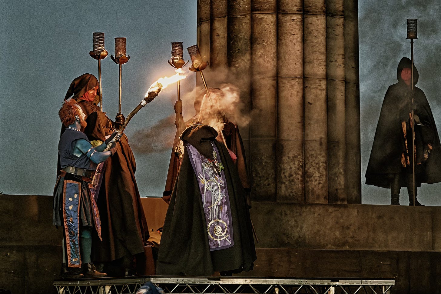 This documentary fieldwork photograph shows the first torch to be lit. No flame is taken into Beltane. This is the first fire made from friction alone. Beltane, Edinburgh 2026