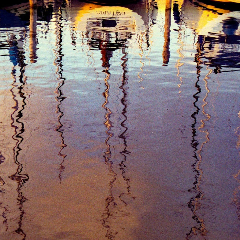 Boats and their reflections in the water. Boats and their reflections in the water.