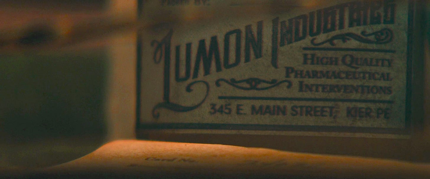 An item on Harmony Cobel’s shrine to Kier that is related to Lumon Industries and “High Quality Pharmaceutical Interventions” An item on Harmony Cobel’s shrine to Kier that is related to Lumon Industries and “High Quality Pharmaceutical Interventions”