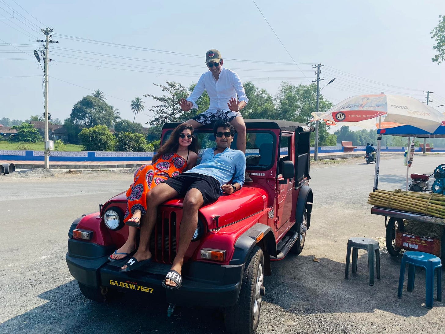May be an image of 2 people, people standing, jeep and outdoors