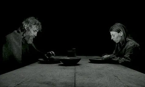 a woman carrying a bucket of water, a man driving a horse, a man and woman eating potatoes in the dark