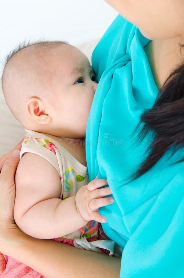 Baby drinking breastmilk stock image. Image of healthy - 63897819