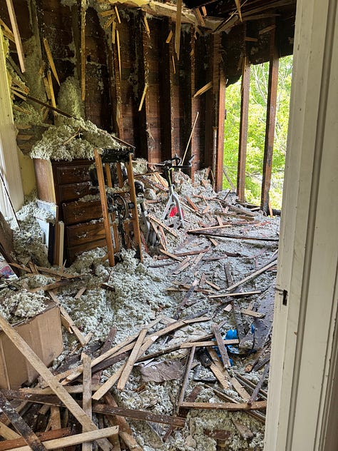 Six photos, three of interior fire damage, two of ongoing repairs, and one of a stack of flooring. 