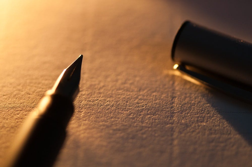 pen and paper in low light