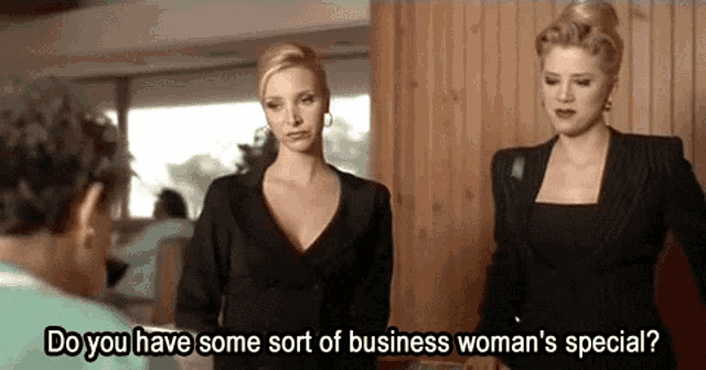 two women are standing next to each other with the words do you have some sort of business woman 's special two women are standing next to each other with the words do you have some sort of business woman 's special