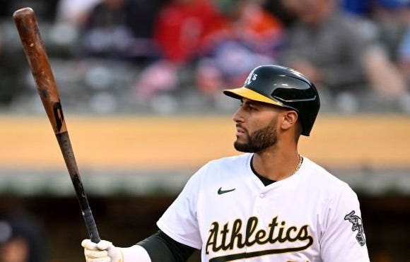 Abraham Toro in an Athletics jersey, with a big wooden bat and a glorious beard