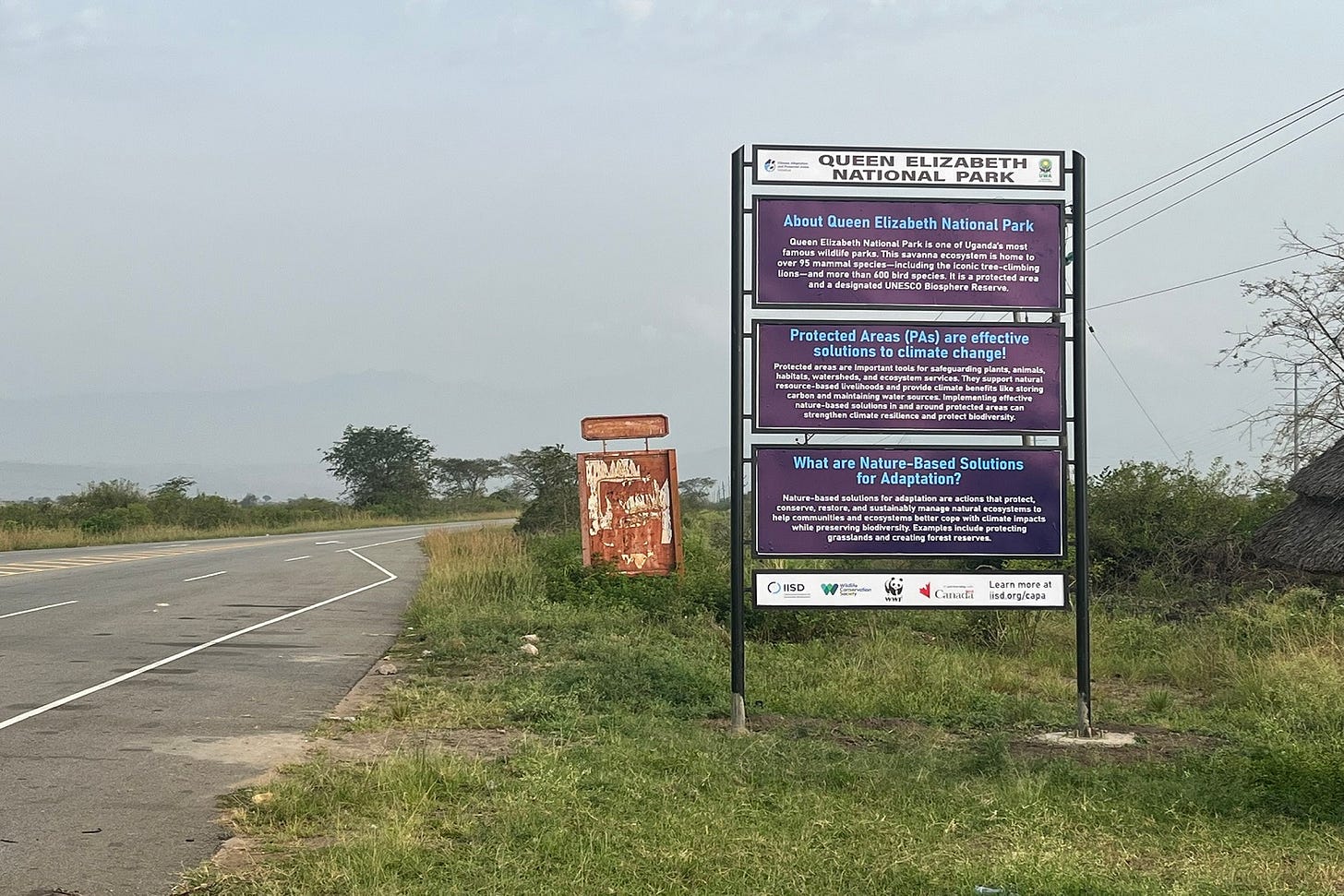 An educational site sign installed by the CAPA initiative near Queen Elizabeth National Park to raise awareness about protected areas and climate change.