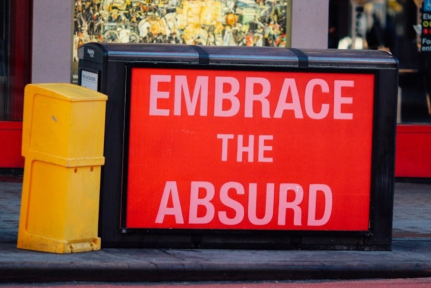 a red sign that says embrace the absurd a red sign that says embrace the absurd