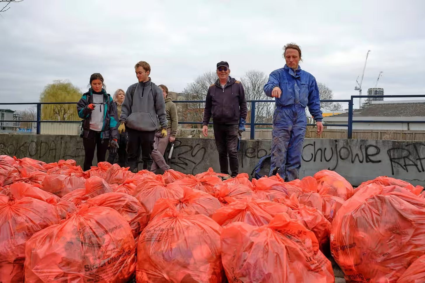 Paul Powesland with River Roding Trust volunteers during a clean-up in Barking. 