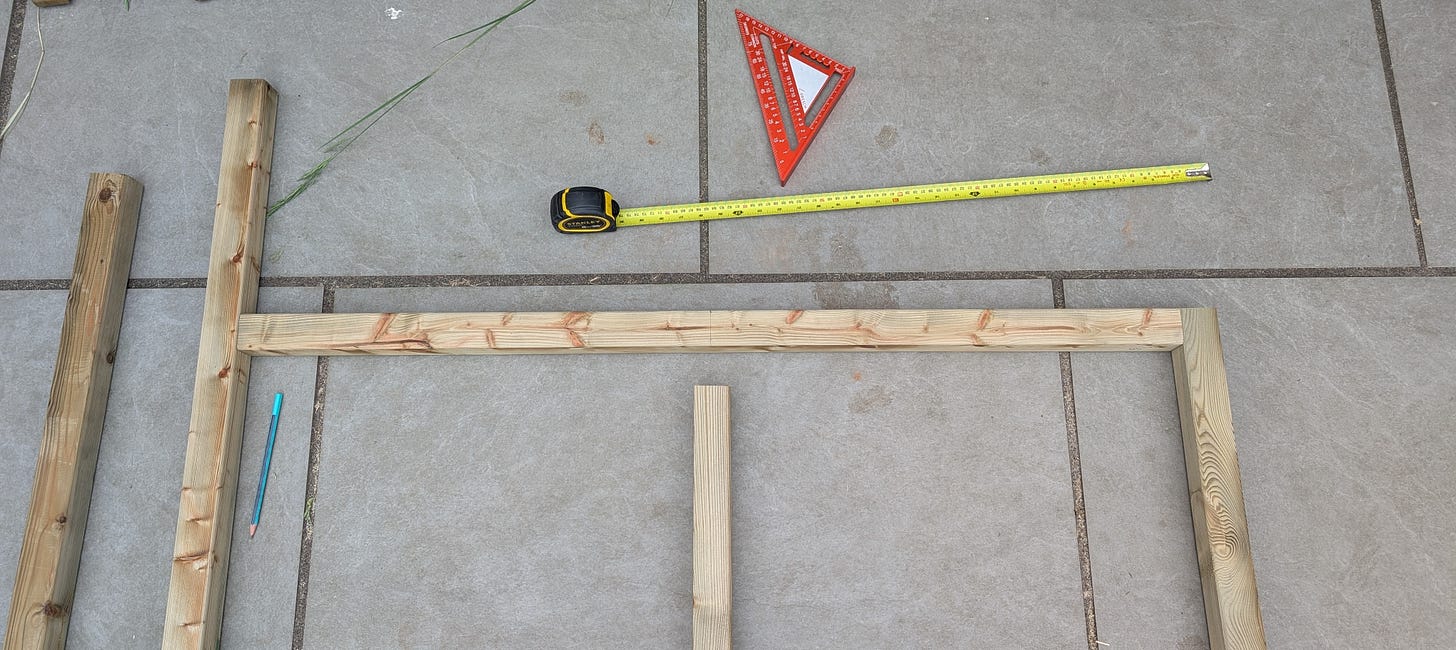 Shed side frame with a central support piece cut too short, highlighting a common woodworking mistake