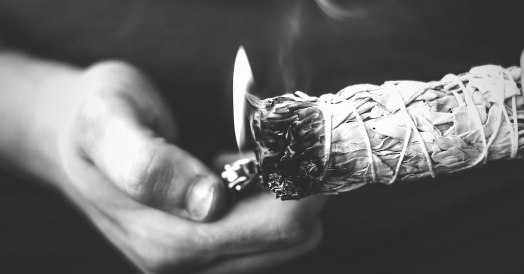 grayscale photo of lighted paper