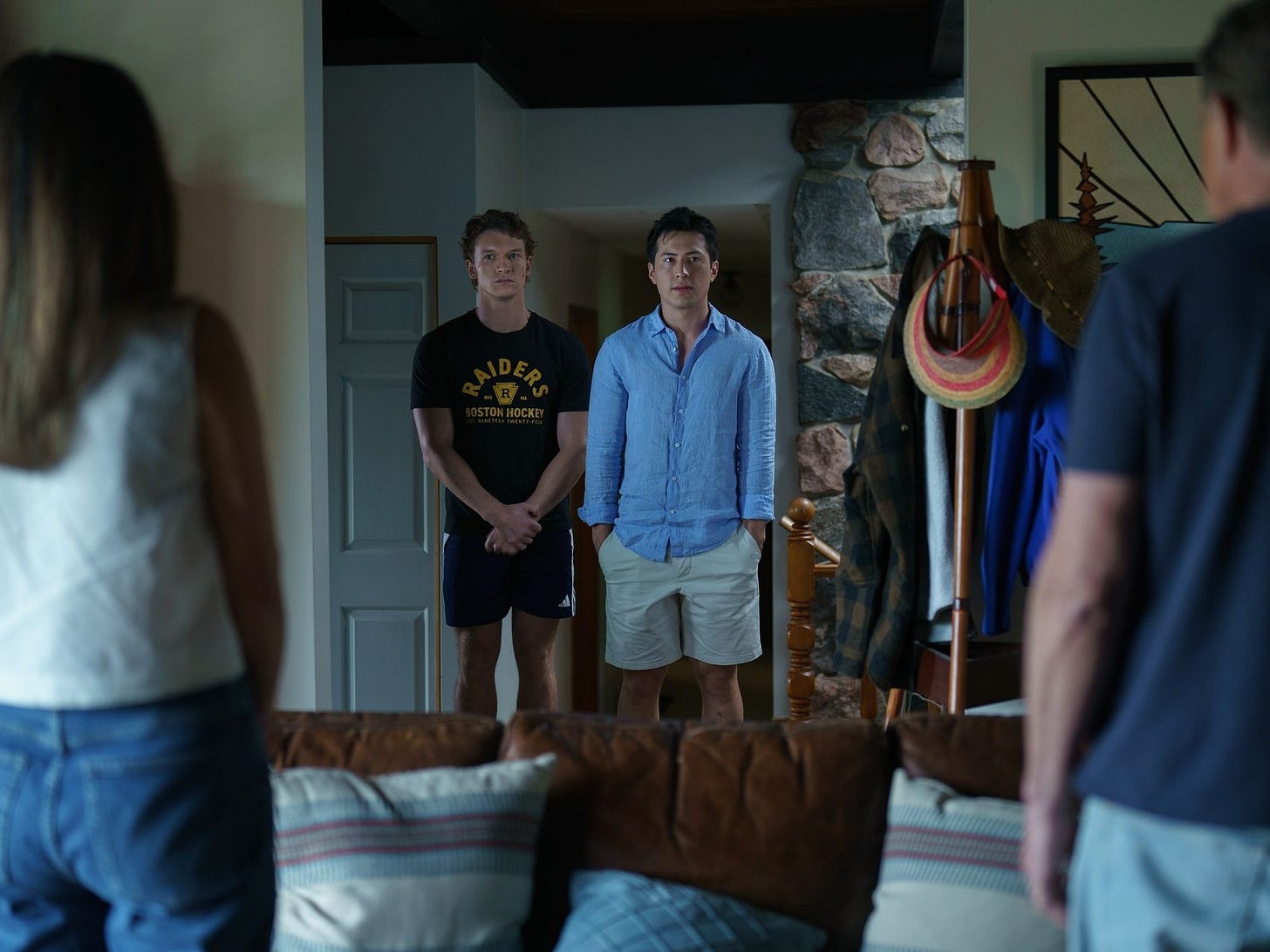 Image may contain Clothing Shorts Pants Couch Furniture Face Head Person Photography Portrait and Architecture