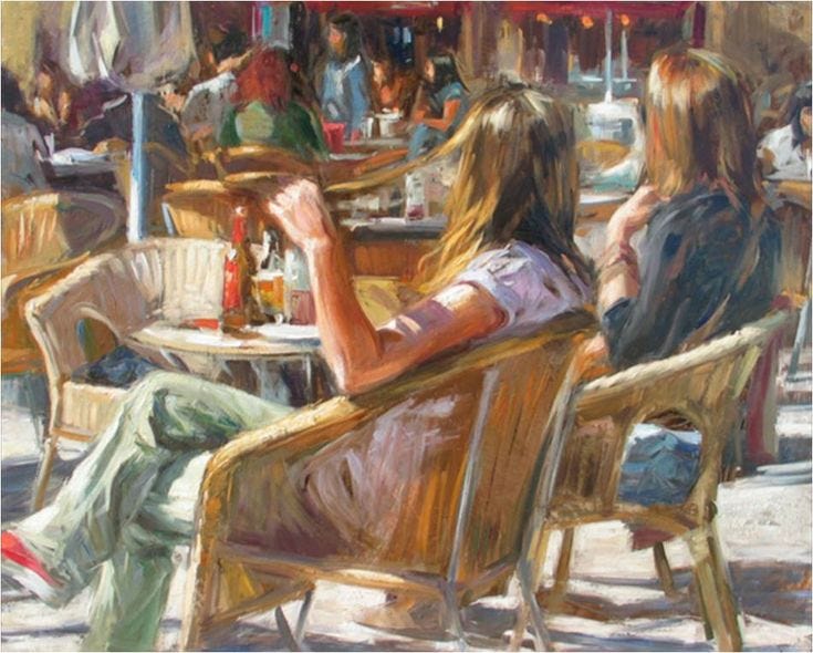 This may contain: two women sitting at an outdoor cafe table eating and drinking beer, while another woman looks on This may contain: two women sitting at an outdoor cafe table eating and drinking beer, while another woman looks on