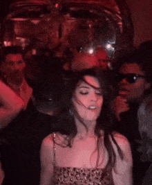 Anne Hathaway at a club dancing, enjoying life.