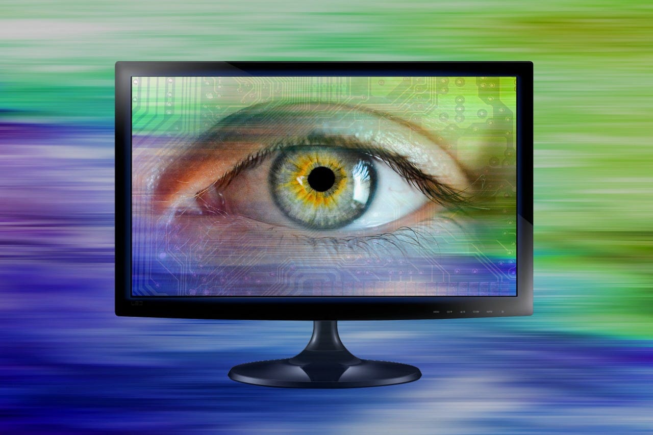 An image of a computer monitor displaying a close up of a human eye.