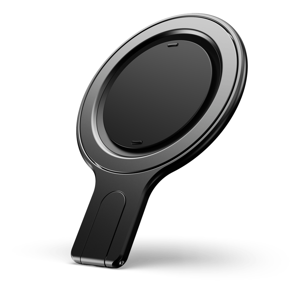 Black circular phone grip stand with a flat base and a raised edge.