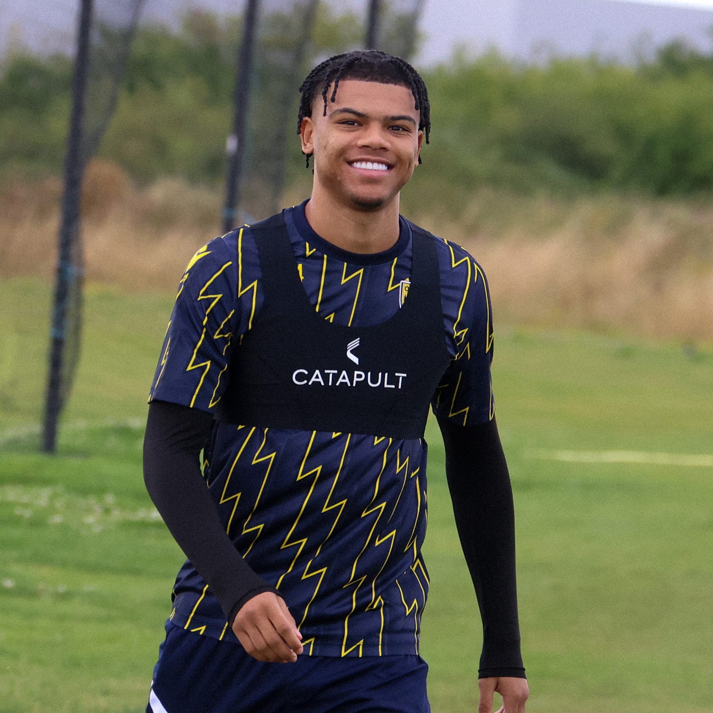 May be an image of 1 person, playing football, playing American football and text