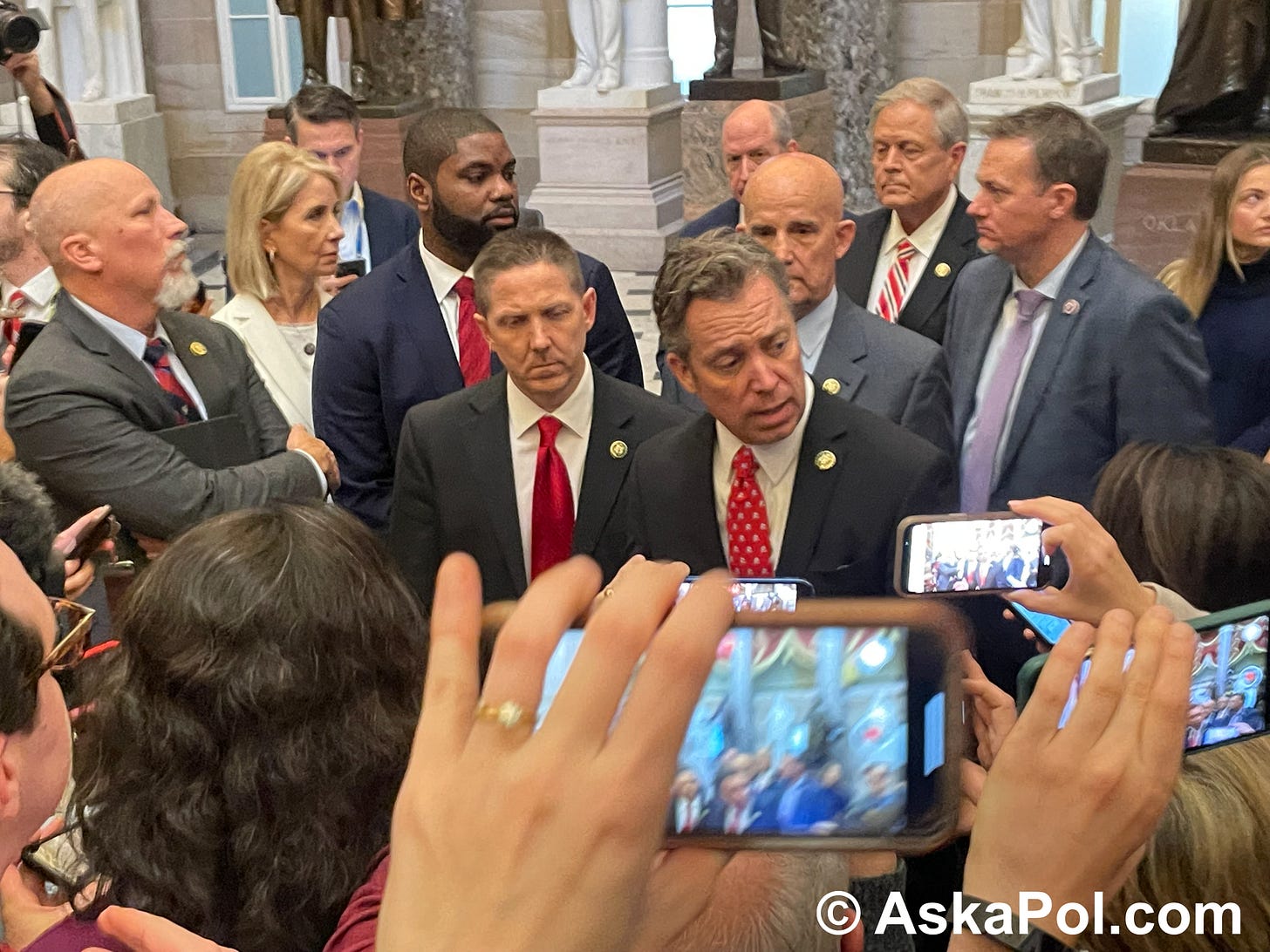 Politicians in suits and ties address camera clicking press corps. Phot: Matt Laslo © www.askapol.com Politicians in suits and ties address camera clicking press corps. Phot: Matt Laslo © www.askapol.com