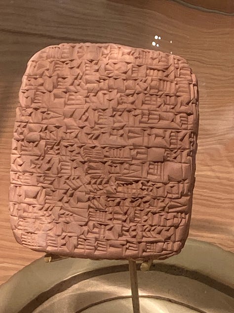 Various texts on scrolls or carved into stones plus the Library at Celcus